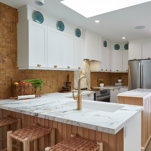Backsplash Blending A spacious kitchen with white cabinets and a two types of backsplash materials