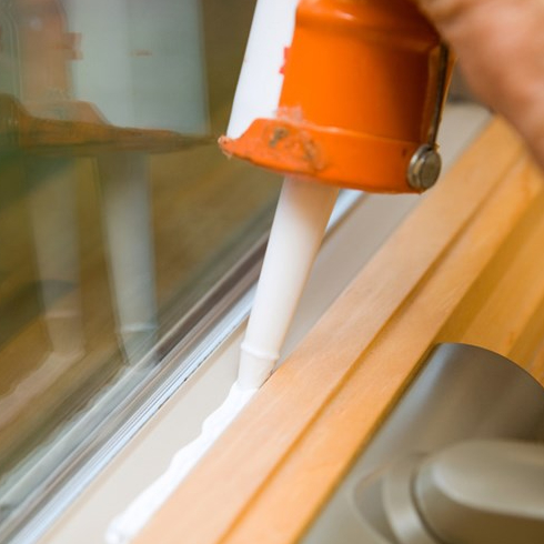 Caulk and Weather Strip Caulking a window