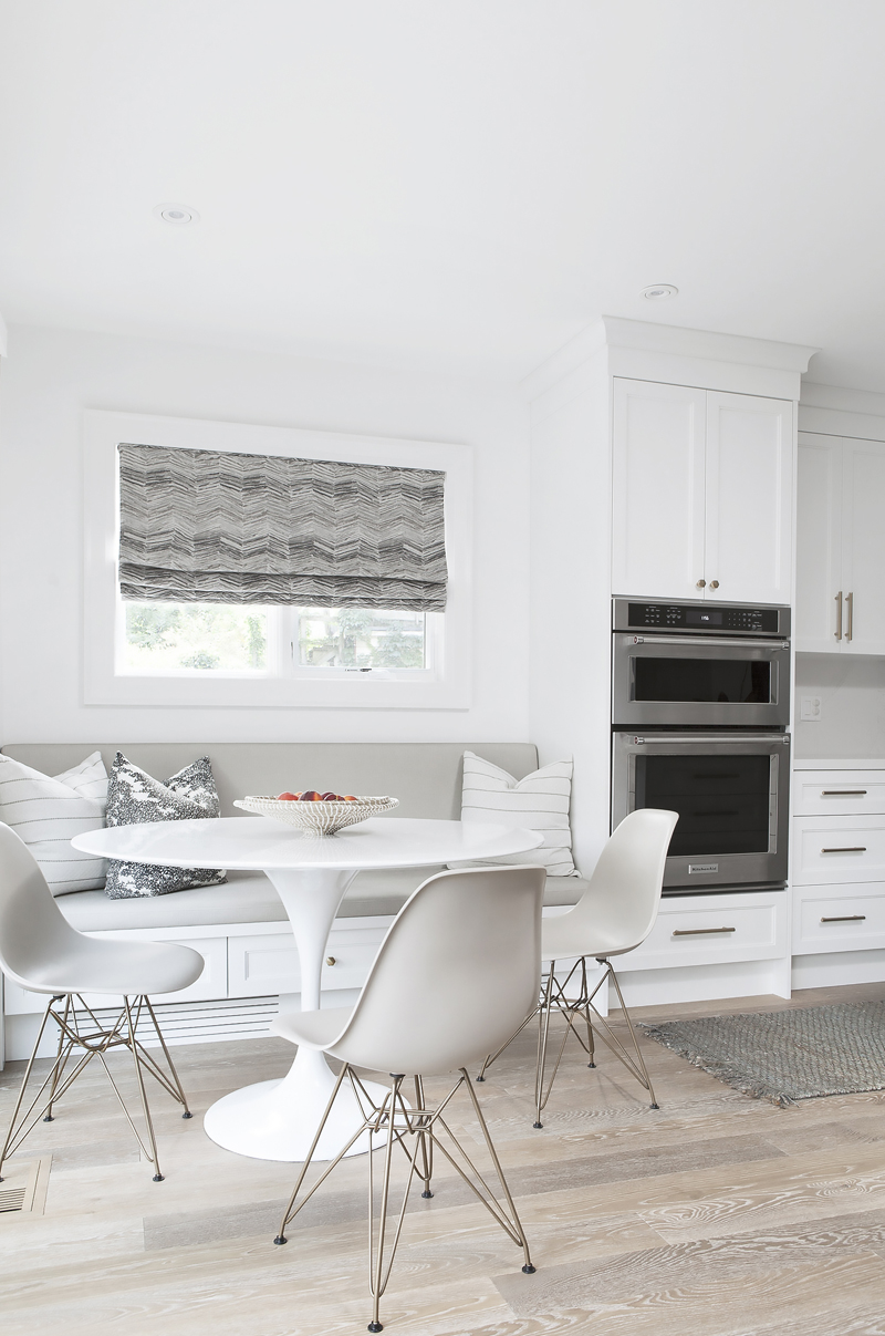 Storage or Light? A breakfast nook flooded with natural light from a window