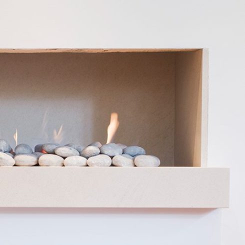A Fireplace Fireplace installed in a basement apartment