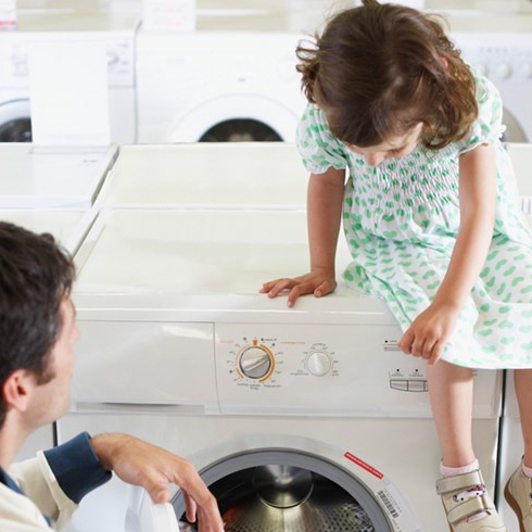 Get Energy-Efficient Appliances Father and daughter look at appliances