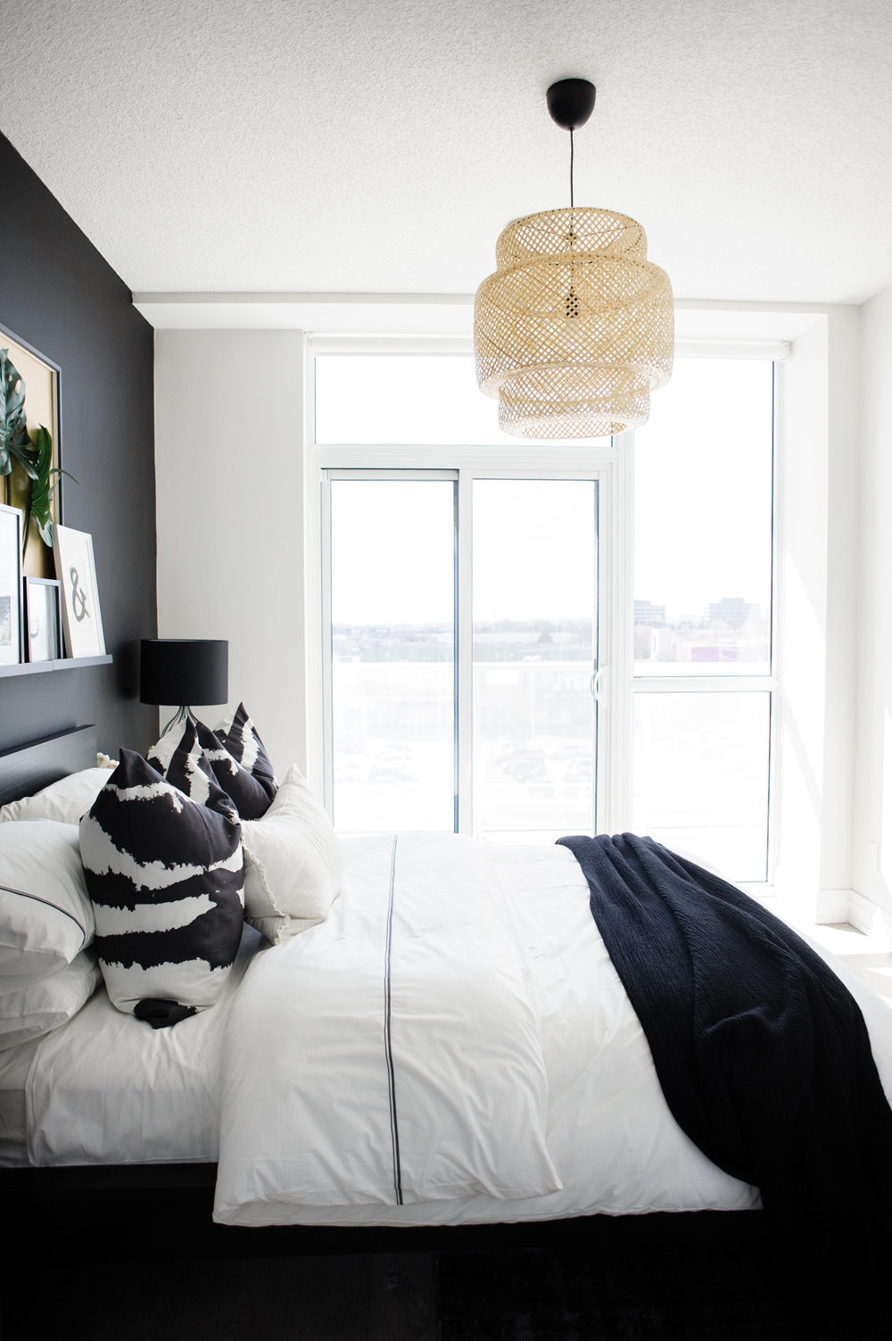 Begin With the Basics White bedding with black and white pillows and throws