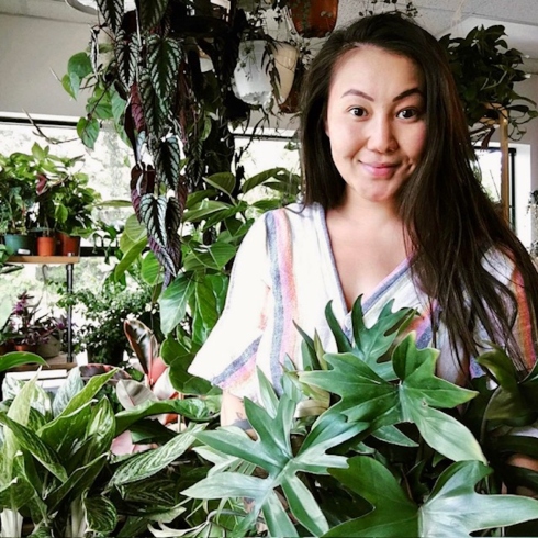House of Plants House of Plants owner Judie Tu surrounded by some of her plant creations