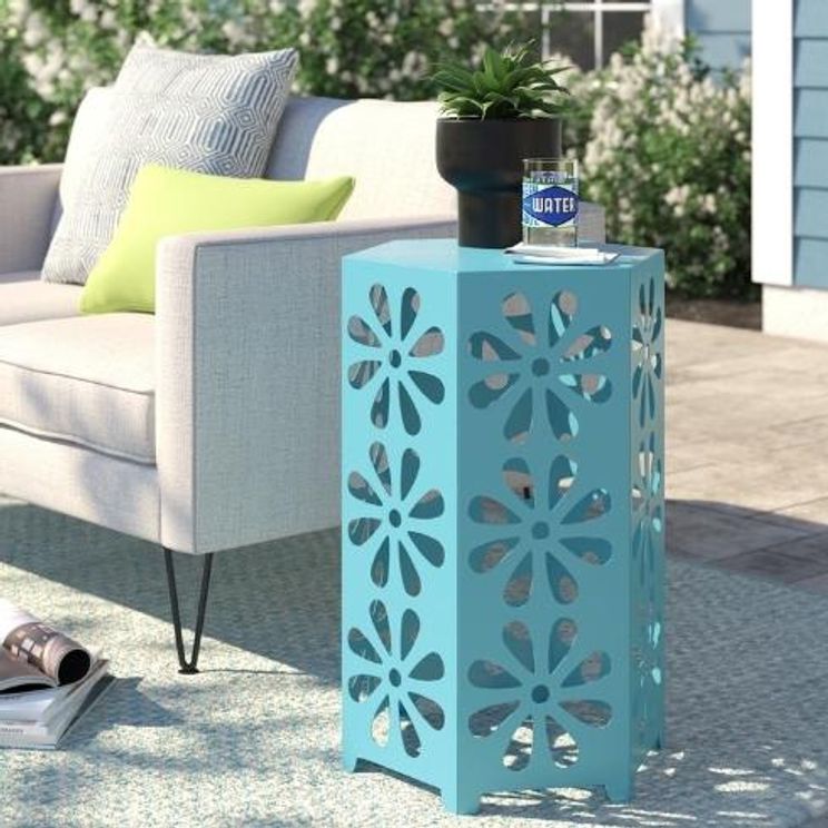 Drying Your Rug sun on rug outside patio with teal table and book