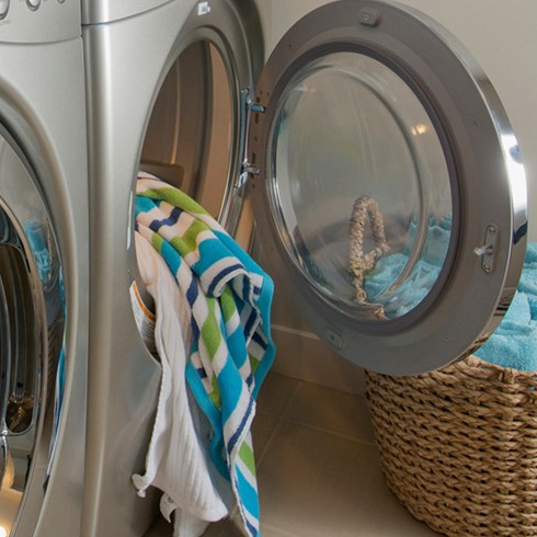 Keep Large Appliances Clean Washer and dryer with dirty clothes inside