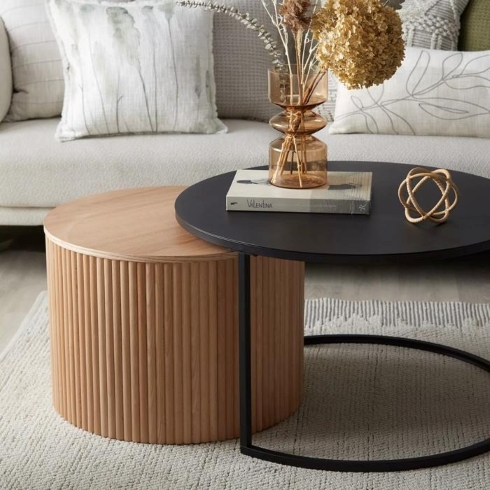 Black Metal and Natural Wood Nesting Coffee Table Black metal and natural wood nesting coffee table.