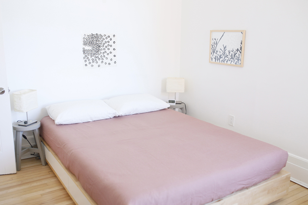 Look Down Below minimal white bedroom with pink bed