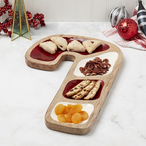 Don’t Be Afraid to Delegate A mix of nuts, dried fried, and baked goods are on a candy cane-shaped serving tray.